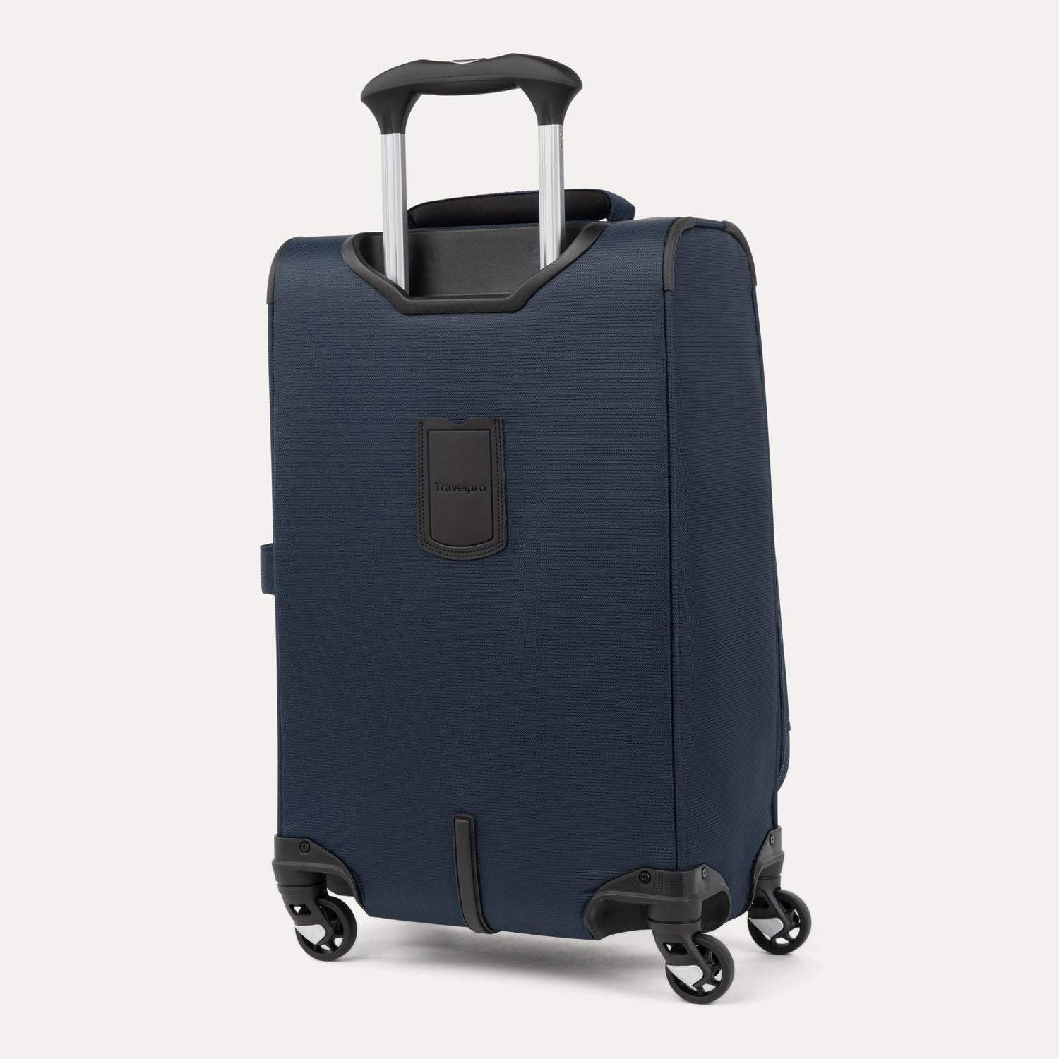 rear-angled view of the midnight blue travelpro maxlite® 5 carry-on spinner, showing the integrated trolley strap for secure stacking and the height-adjustable powerscope lite extension handle.