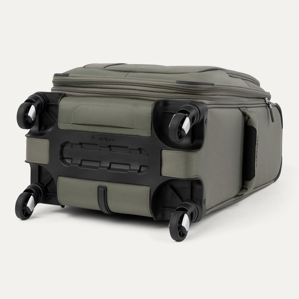 bottom view of the slate green travelpro maxlite® 5 carry-on spinner, showing the four 360-degree spinner wheels, the protective plastic bottom molding with the travelpro logo, and the durable fabric base.