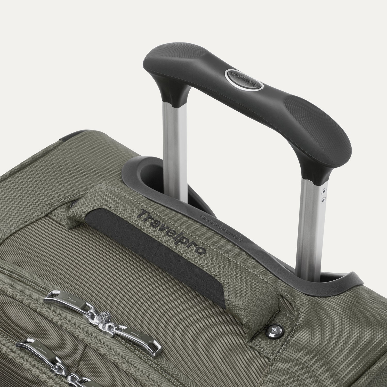 close-up view of the slate green travelpro maxlite® 5 carry-on spinner, showing the cushioned top carry handle with the travelpro logo and the rubberized contour grip on the powerscope lite extension handle.