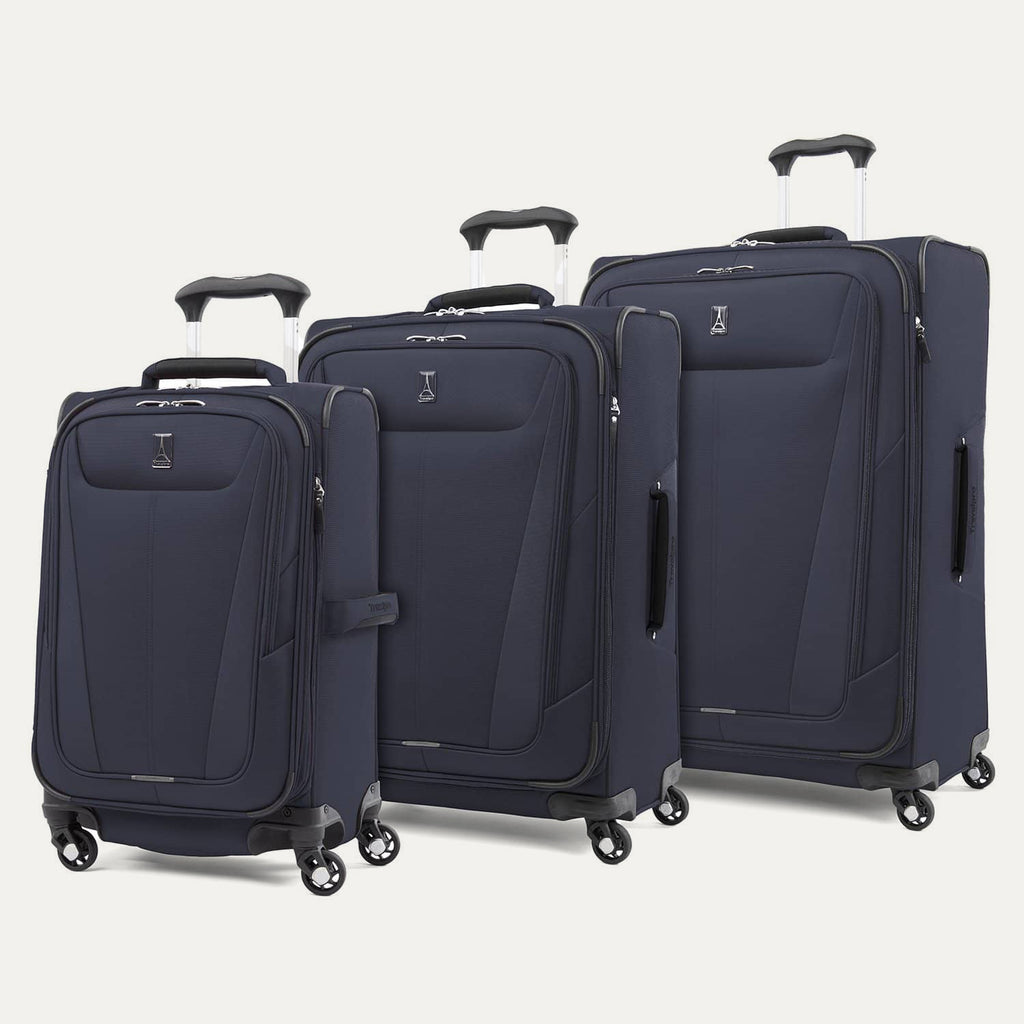 a three-piece luggage set featuring the midnight blue travelpro maxlite® 5 carry-on, medium, and large expandable spinners arranged together in a group view.