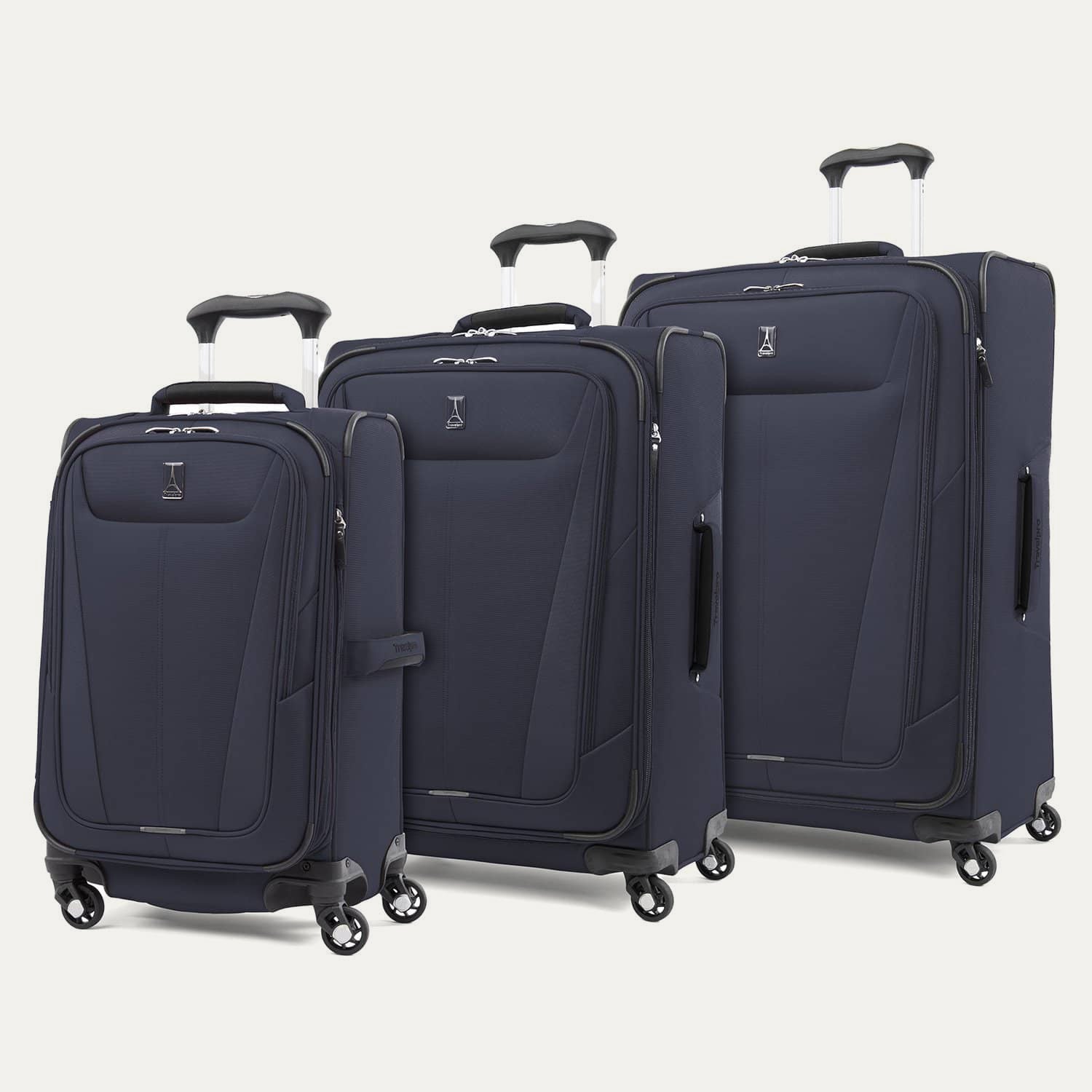 a three-piece luggage set featuring the midnight blue travelpro maxlite® 5 carry-on, medium, and large expandable spinners arranged together in a group view.