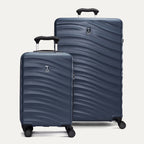 a two-piece hardside luggage set featuring the midnight blue travelpro maxlite® air v2 compact carry-on and large check-in spinners arranged together in a group view.