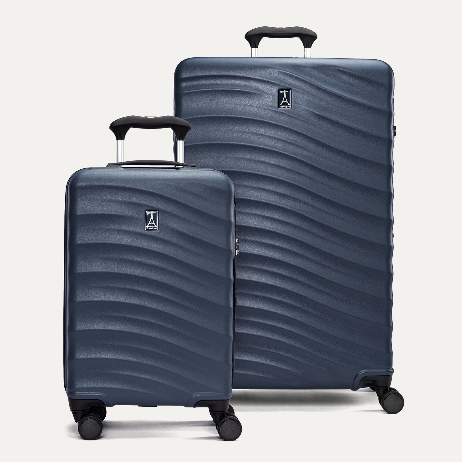 a two-piece hardside luggage set featuring the midnight blue travelpro maxlite® air v2 compact carry-on and large check-in spinners arranged together in a group view.