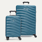 a two-piece hardside luggage set featuring the teal travelpro maxlite® air v2 compact carry-on and large check-in spinners arranged together in a group view.