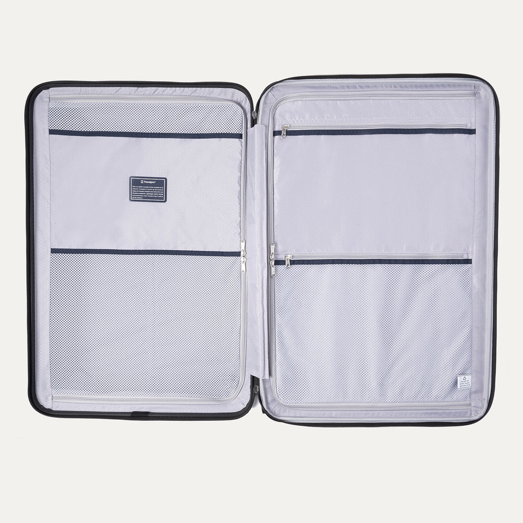 interior view of the open teal travelpro maxlite® air v2 hardside spinner, showing two zippered divider panels with built-in mesh pockets and the lightweight grey lining for organized packing.