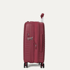 side profile view of the tibetan red travelpro optima® expandable carry-on hardside spinner, shown with the zippered expansion feature fully open to provide additional packing capacity.