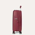 side profile view of the tibetan red travelpro optima® expandable carry-on hardside spinner, highlighting the integrated tsa-approved combination lock, flush-mount side carry handle, and the zippered expansion seam.