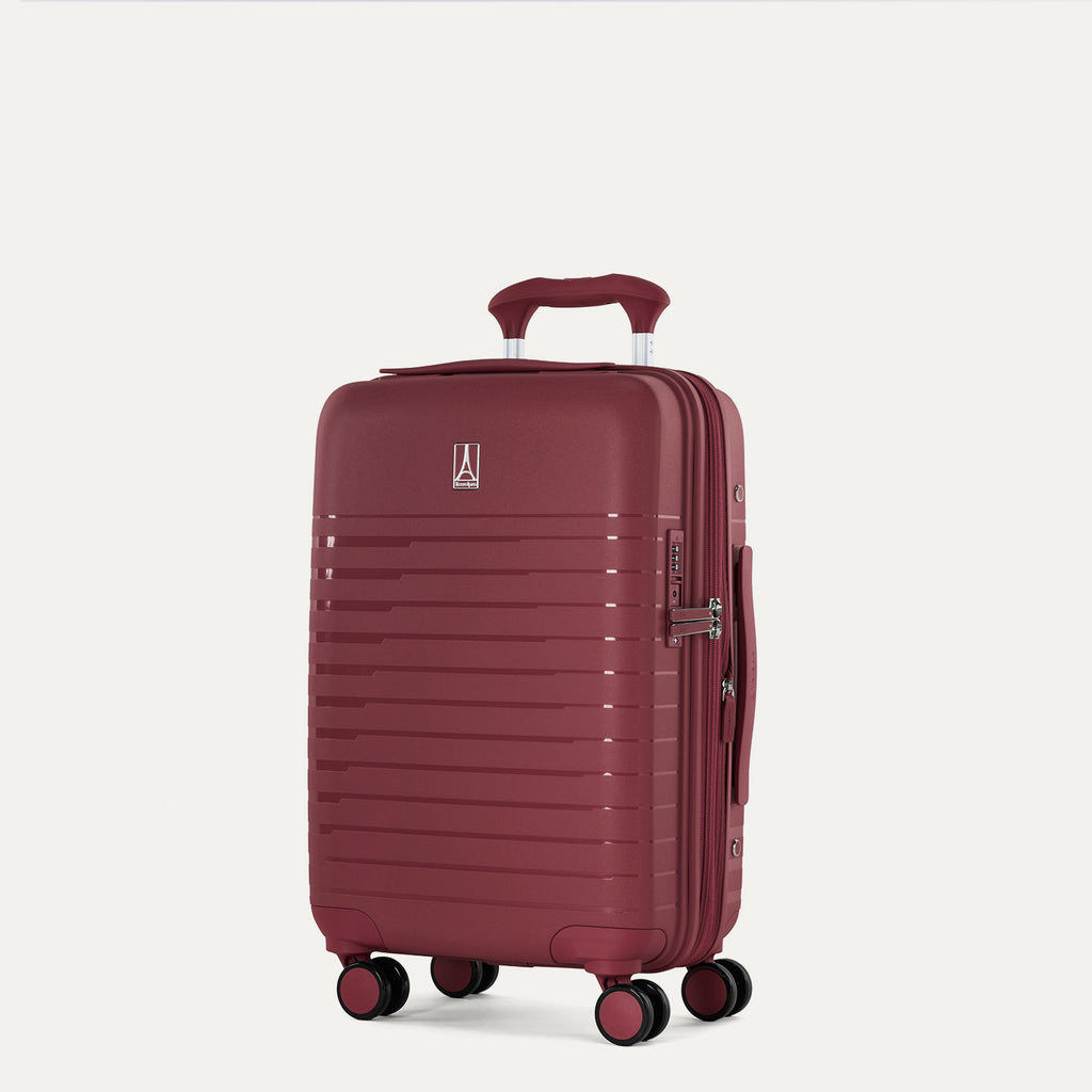three-quarter front view of the tibetan red travelpro optima® expandable compact carry-on hardside spinner, showing the side-mounted tsa-approved lock, integrated side handle, and smooth-rolling spinner wheels.
