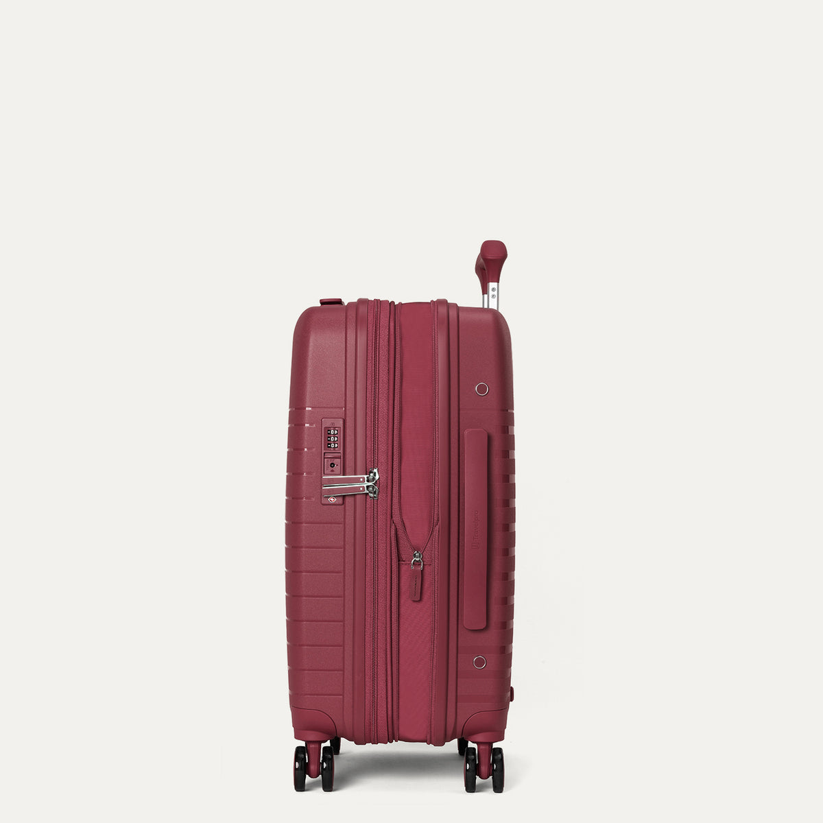 side profile view of the tibetan red travelpro optima® expandable compact carry-on hardside spinner, shown with the zippered expansion feature fully open to provide additional packing capacity.