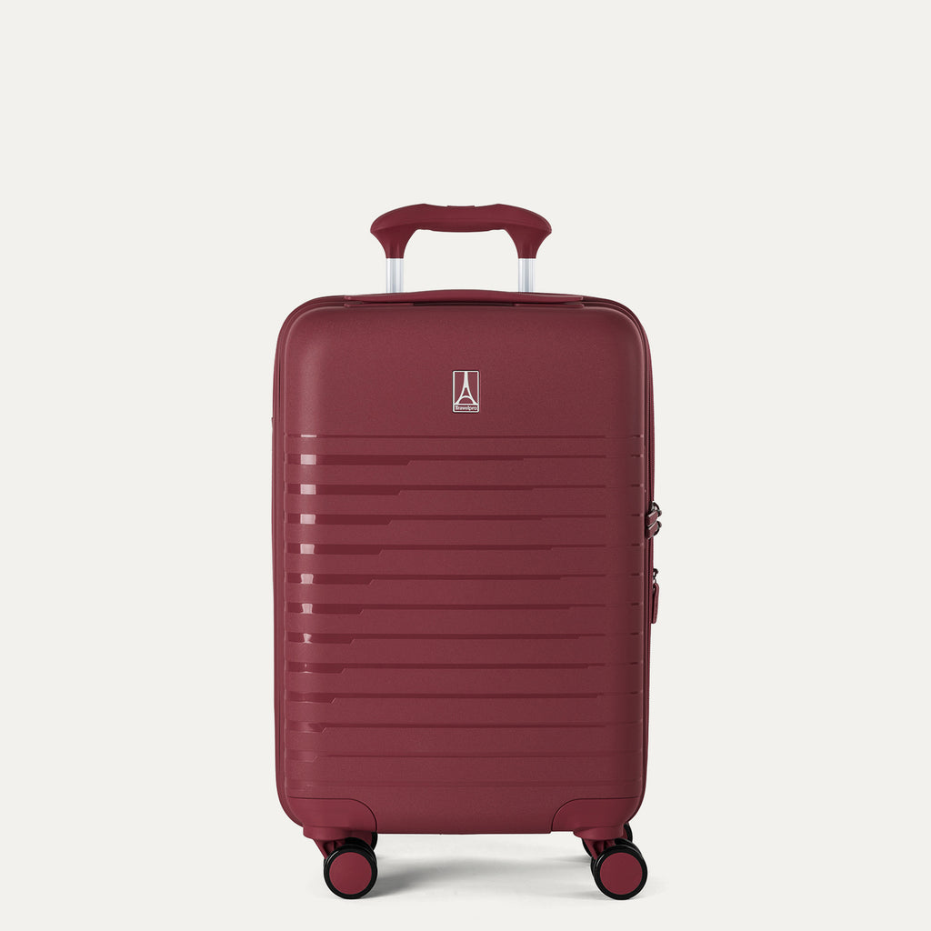 front view of the tibetan red travelpro optima® expandable compact carry-on hardside spinner, featuring a durable polypropylene shell with horizontal ribbing and a color-matched telescoping handle.