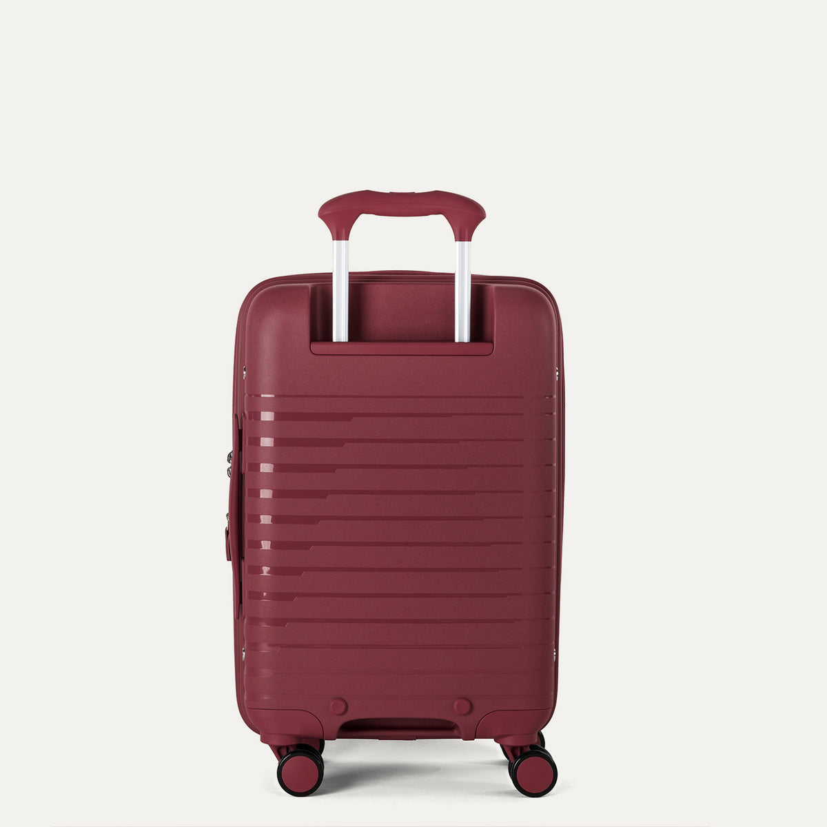 rear view of the tibetan red travelpro optima® expandable compact carry-on hardside spinner, showing the textured polypropylene shell and the color-matched powerscope lite extension handle.