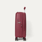 side profile view of the tibetan red travelpro optima® expandable compact carry-on hardside spinner, highlighting the integrated tsa-approved combination lock, flush-mount side carry handle, and the zippered expansion seam.