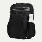 side view of the black travelpro platinum elite business laptop backpack 27l, showing a white reusable water bottle tucked into the integrated side pocket.
