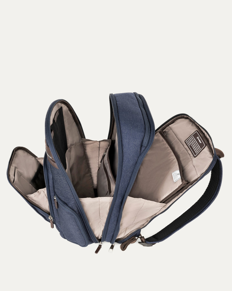 Interior view of Travelpro Platinum Elite Business Backpack in True Navy, showing padded tech compartments and spacious organization.
