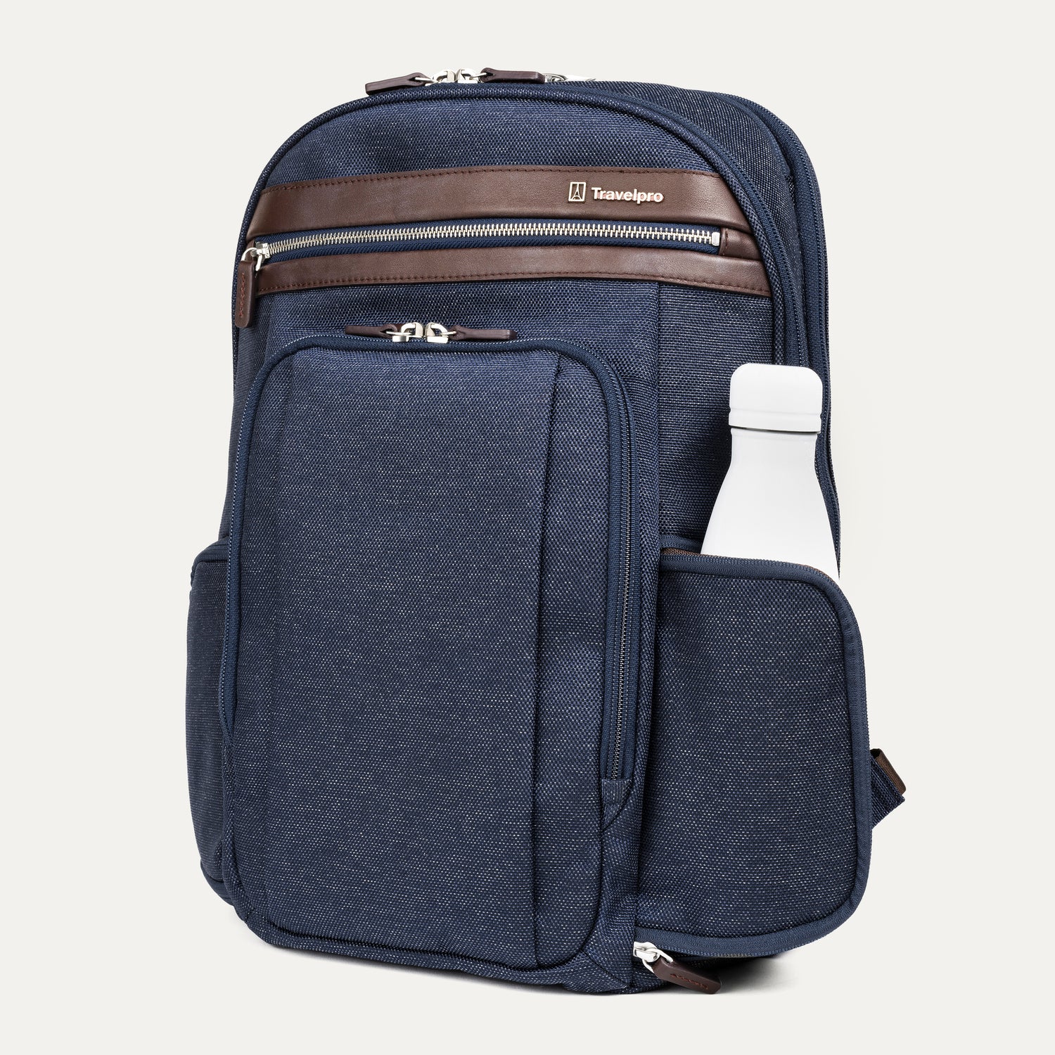 side view of the true navy travelpro platinum elite business laptop backpack 27l, showing a white reusable water bottle tucked into the side pocket with dark brown leather trim.