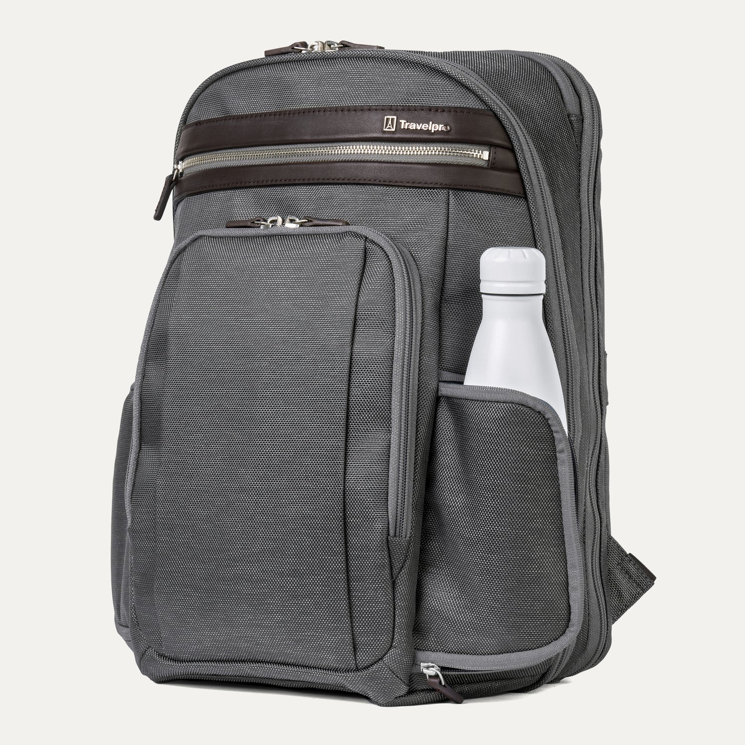 side view of the vintage grey travelpro platinum elite business laptop backpack 27l, showing a white reusable water bottle tucked into the integrated side pocket with dark brown leather trim.