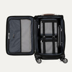 interior packing view of the open shadow black travelpro platinum elite carry-on, showing the organized main compartment with adjustable hold-down straps, a zippered accessory pocket, and a mesh divider panel.