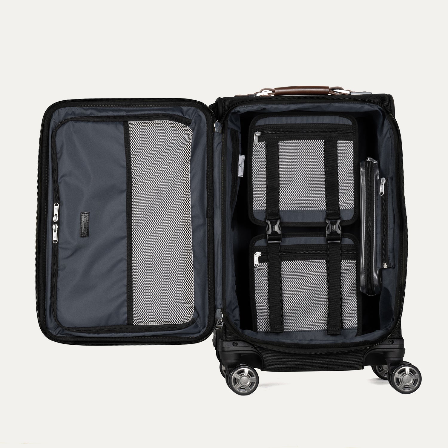 interior packing view of the open shadow black travelpro platinum elite carry-on, showing the organized main compartment with adjustable hold-down straps, a zippered accessory pocket, and a mesh divider panel.