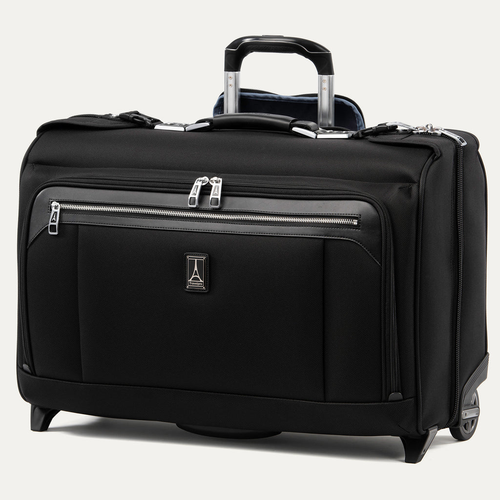 front-angled view of the shadow black travelpro platinum® elite carry-on rolling garment bag, showing the low-profile design, large front organizer pocket, and the airline-grade powerscope extension handle.