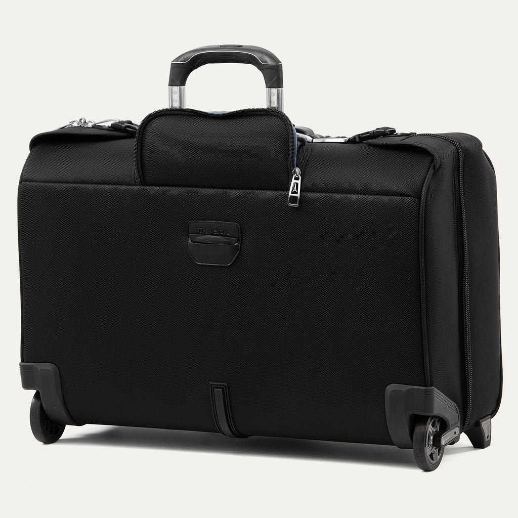 rear and side view of the shadow black travelpro platinum® elite carry-on rolling garment bag, featuring high-performance ball-bearing wheels, a sturdy bottom stabilizer bar, and a rear trolley strap for secure stacking on other luggage.