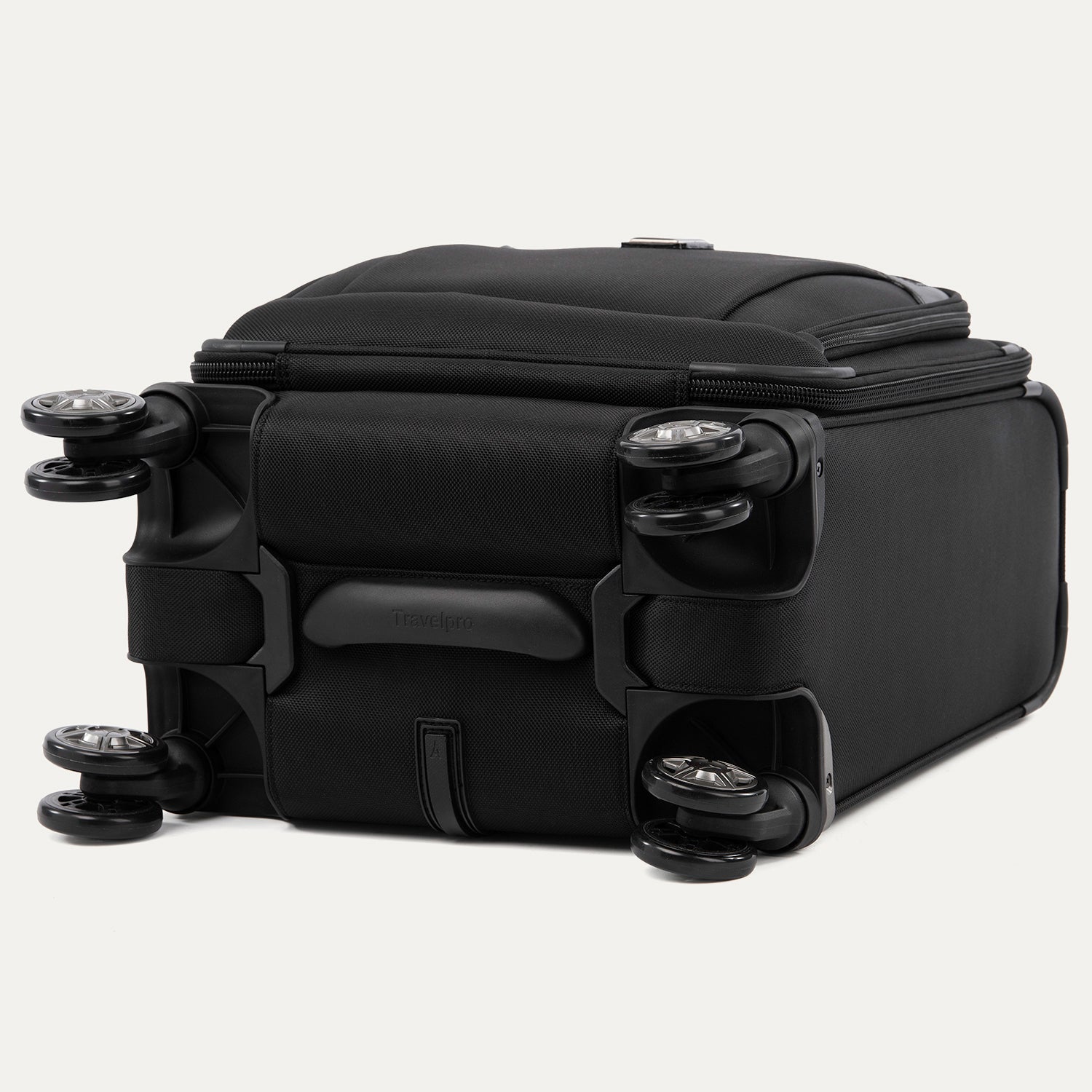 bottom view of the shadow black travelpro platinum® elite carry-on spinner tote, showing the four high-performance magnatrac® self-aligning spinner wheels, the protective bottom molding, and the durable fabric construction.