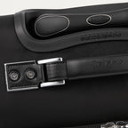 close-up top view of the shadow black travelpro platinum® elite carry-on spinner tote, showing the leather top carry handle with silver-tone hardware, the embossed travelpro logo, and the contour grip on the powerscope extension handle.