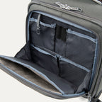 close-up interior view of the front organizer compartment on the vintage grey travelpro platinum® elite carry-on spinner tote, showing multiple grey mesh slip pockets, a key leash, and organized storage for small travel essentials.