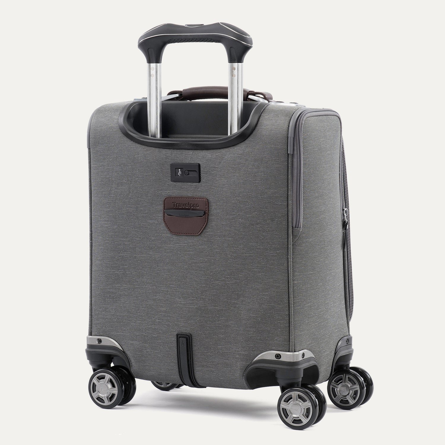 rear-angled view of the vintage grey travelpro platinum® elite carry-on spinner tote, showing the integrated trolley strap for stacking on luggage, the external usb port, and high-performance magnatrac® self-aligning spinner wheels.