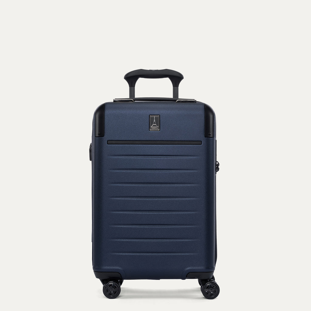 front view of the travelpro platinum elite compact carry-on hardside spinner in aviator navy, showing the durable polycarbonate shell, precision-engineered telescoping handle, and self-aligning spinner wheels.