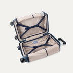 interior view of the travelpro platinum elite compact carry-on hardside spinner in dark sky blue, showing the organized compartment with adjustable tie-down straps and the signature ecofab™ lining.