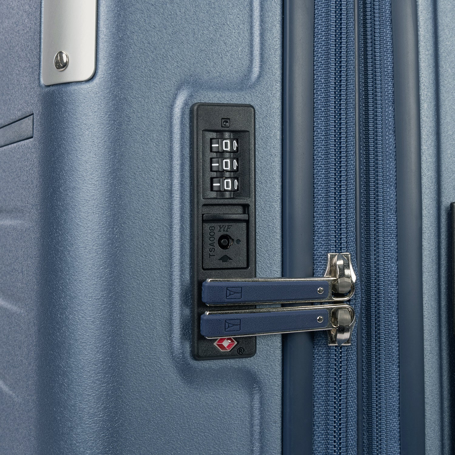 close-up of the integrated tsa-approved combination lock on the travelpro platinum elite compact carry-on hardside spinner in dark sky blue, showing the dual zipper pulls securely locked into the mechanism.