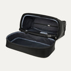 fully opened main compartment of the black travelpro platinum elite weekender bag, showing the spacious interior with a grey lining and a large zippered pocket for organized packing.