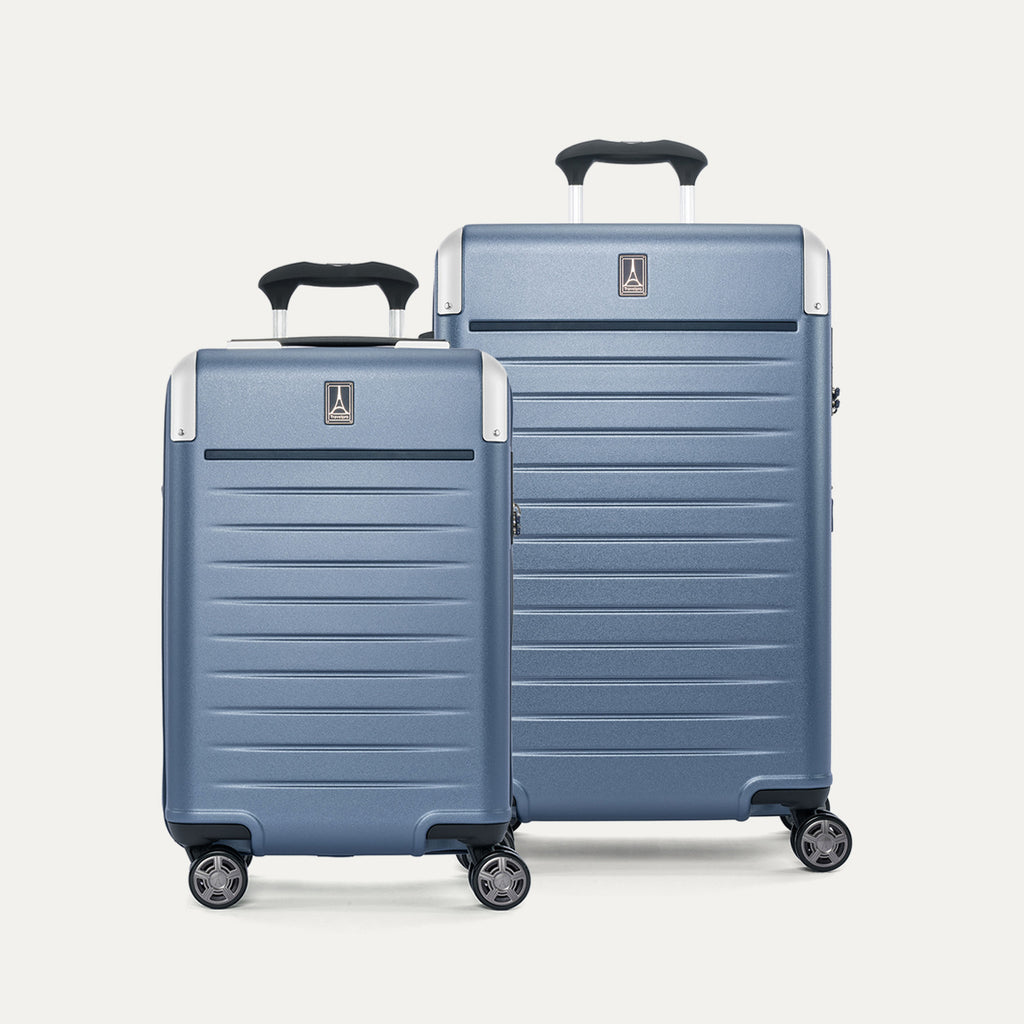 Front view of the Travelpro Platinum Elite 2-Piece Hardside Spinner Set in Dark Sky Blue, featuring the Carry-On and Medium Check-In suitcases with 100% polycarbonate shells and genuine leather trim.