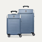 Front view of the Travelpro Platinum Elite 2-Piece Hardside Spinner Set in Dark Sky Blue, featuring the Carry-On and Medium Check-In suitcases with 100% polycarbonate shells and genuine leather trim.