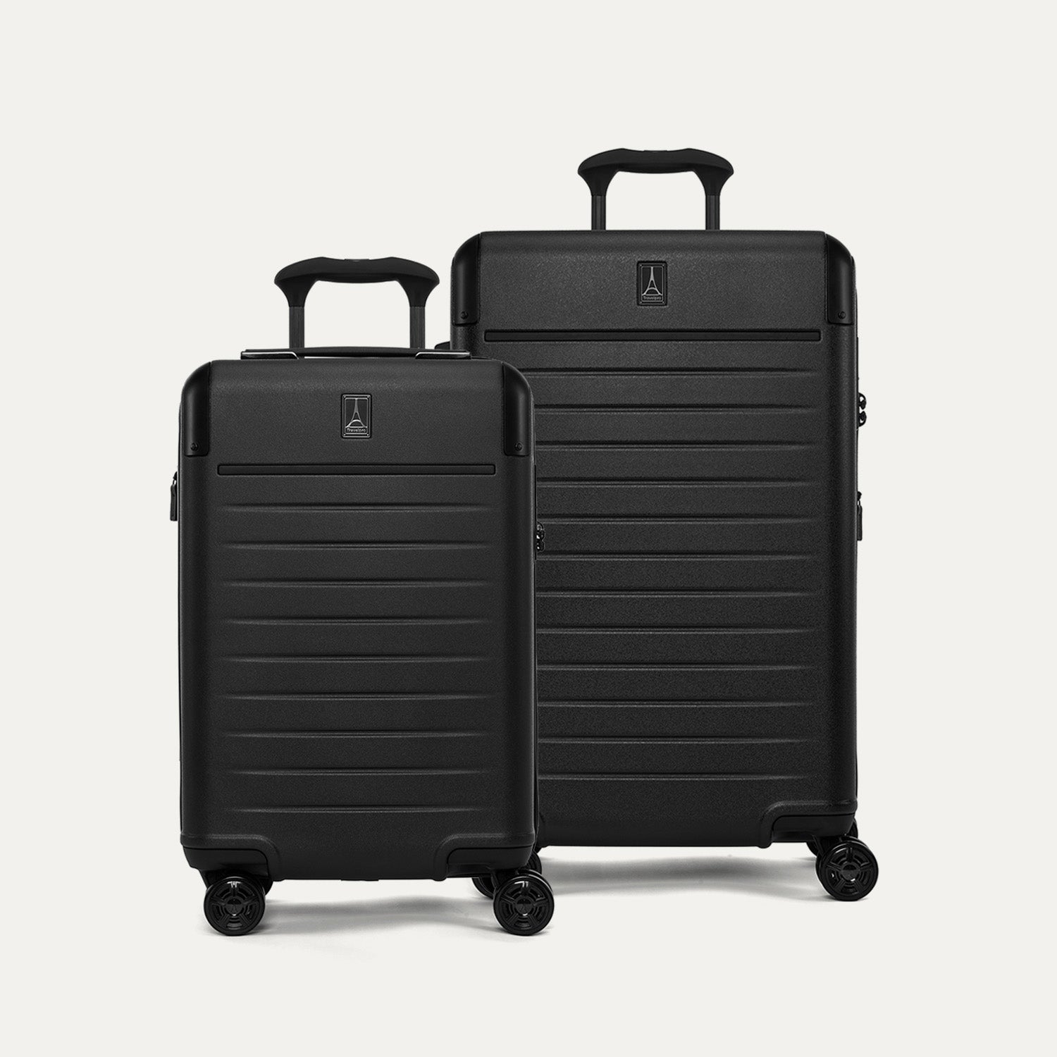 Front view of the Travelpro Platinum Elite 2-Piece Hardside Spinner Set in Jet Black, including the Carry-On and Medium Check-In suitcases with 100% polycarbonate shells and genuine leather trim.