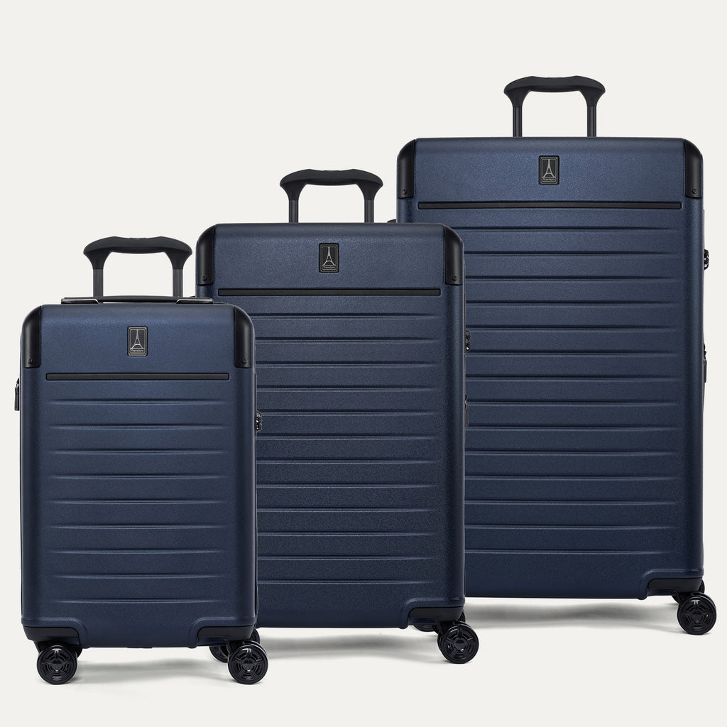 Front view of the Travelpro Platinum Elite 3-Piece Hardside Spinner Set in Aviator Navy, including the Compact Carry-On, Medium Check-In, and Large Check-In suitcases with 100% polycarbonate shells and aluminum corner armor.