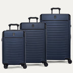Front view of the Travelpro Platinum Elite 3-Piece Hardside Spinner Set in Aviator Navy, including the Compact Carry-On, Medium Check-In, and Large Check-In suitcases with 100% polycarbonate shells and aluminum corner armor.