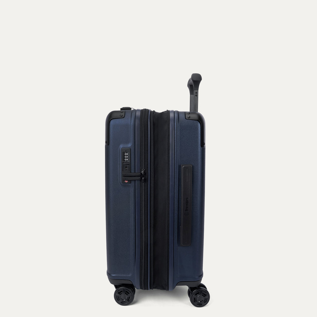 Side profile view of the Travelpro Platinum Elite Carry-On Hardside Spinner in Aviator Navy, showing the zippered expansion gusset that provides an additional 2 inches of packing capacity.