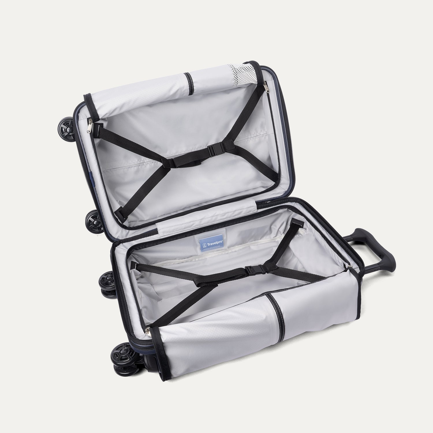 Fully open interior packing view of the Travelpro Platinum Elite Carry-On Hardside Spinner in Aviator Navy, showing the main compartment with adjustable hold-down straps and the sustainable ECOFAB™ lining.