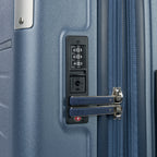 Close-up detail of the Travelpro Platinum Elite Carry-On Hardside Spinner in Dark Sky Blue, showing the integrated TSA-approved combination lock and secure zipper pulls on the durable polycarbonate shell.