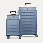 Front view of the 2-piece Travelpro Platinum Elite Hardside Set in Dark Sky Blue, featuring the Compact Carry-On and large Check-In Expandable Spinners with durable polycarbonate shells and aluminum corner guards.