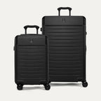 Front view of the 2-piece Travelpro Platinum Elite Hardside Set in Jet Black, featuring the Compact Carry-On and Large Check-In Expandable Spinners with durable polycarbonate shells and aluminum corner armor.