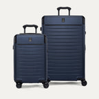 Front view of the 2-piece Travelpro Platinum Elite Hardside Set in Aviator Navy, featuring the Compact Carry-On and Medium Check-In Expandable Spinners with 100% polycarbonate shells and aluminum corner guards.