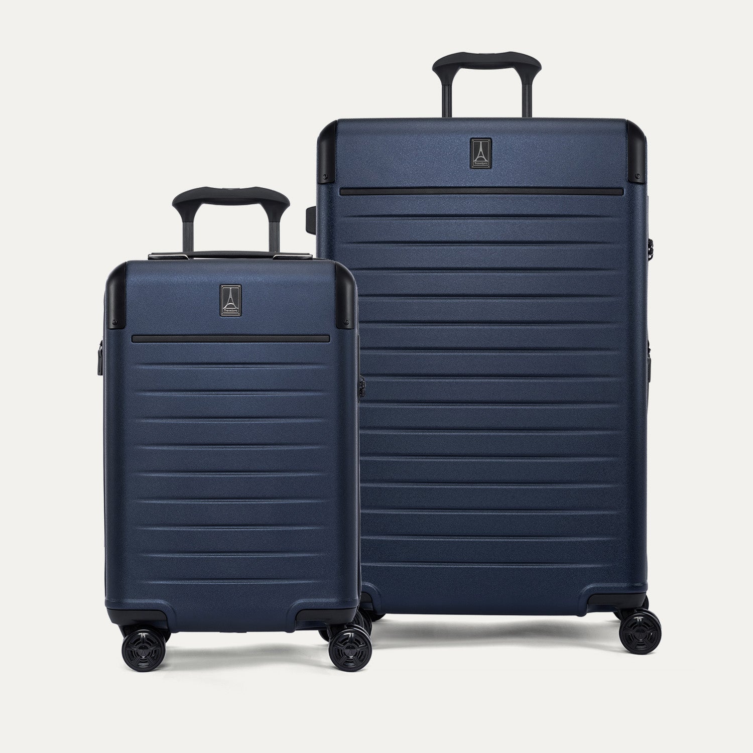 Front view of the 2-piece Travelpro Platinum Elite Hardside Set in Aviator Navy, featuring the Compact Carry-On and Medium Check-In Expandable Spinners with 100% polycarbonate shells and aluminum corner guards.