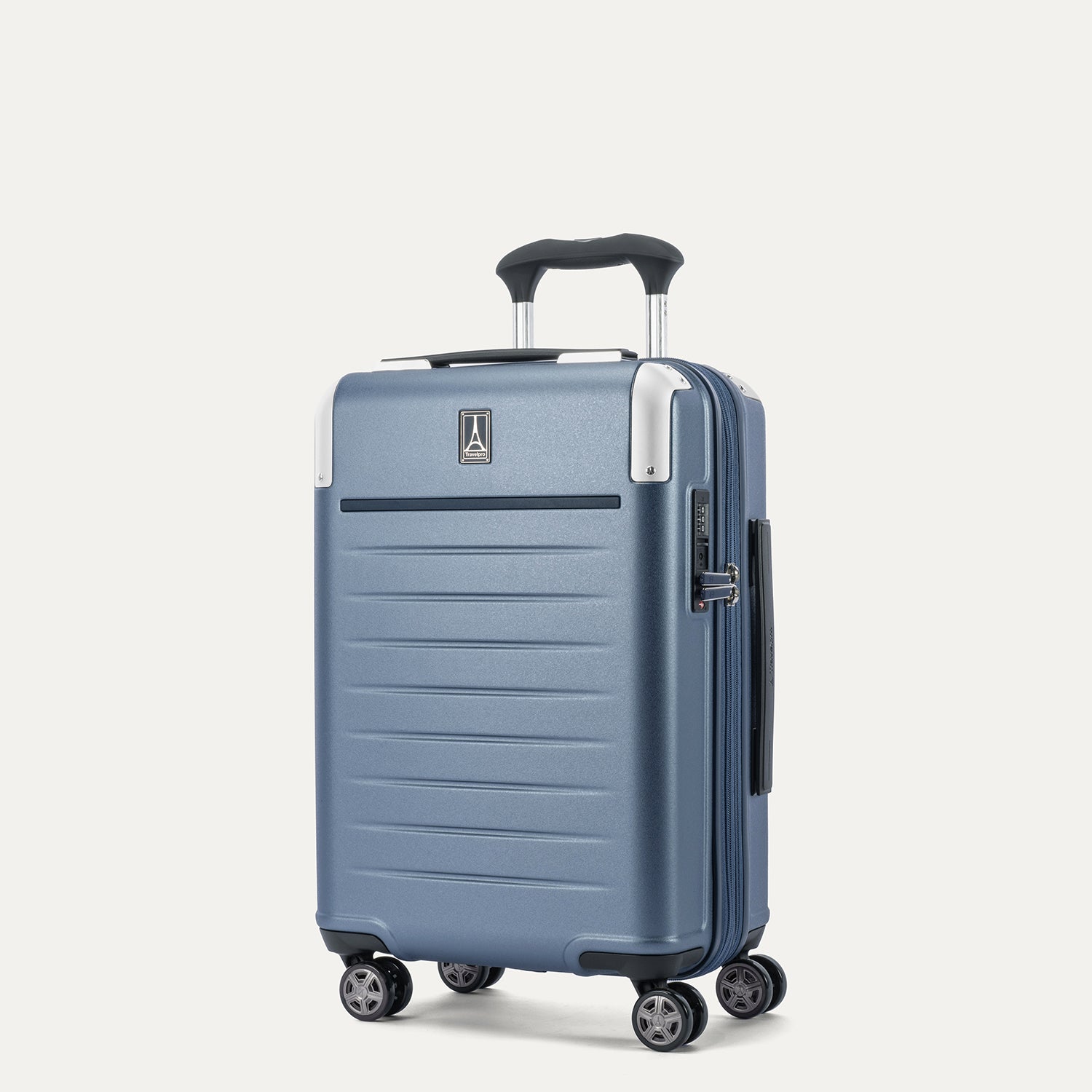 Front 3/4 view of the Travelpro Platinum Elite Compact Carry-On Hardside Spinner in Dark Sky Blue, featuring a high-durability polycarbonate shell, chrome logo, and dual spinner wheels.
