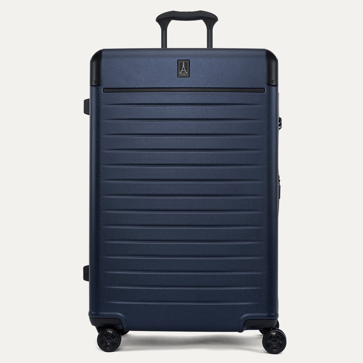 Front view of the Travelpro Platinum Elite Large Check-In Hardside Spinner in Aviator Navy, featuring a high-durability 100% polycarbonate shell, aluminum corner guards, and 360-degree MagnaTrac self-aligning spinner wheels.