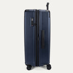 Side profile view of the Travelpro Platinum Elite Large Check-In Hardside Spinner in Aviator Navy, showing the expansion zipper, integrated TSA-approved lock, and side carry handle.