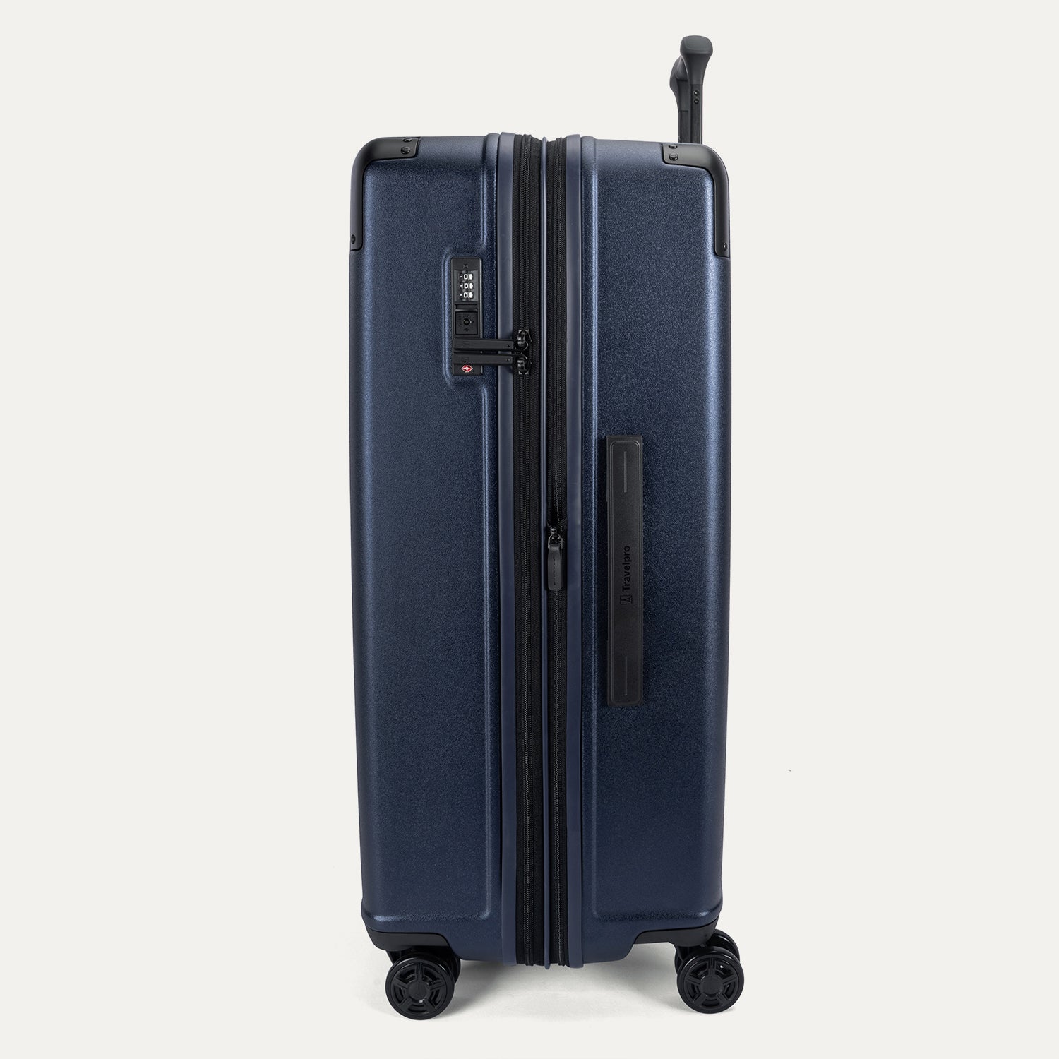 Side profile view of the Travelpro Platinum Elite Large Check-In Hardside Spinner in Aviator Navy, showing the expansion zipper, integrated TSA-approved lock, and side carry handle.