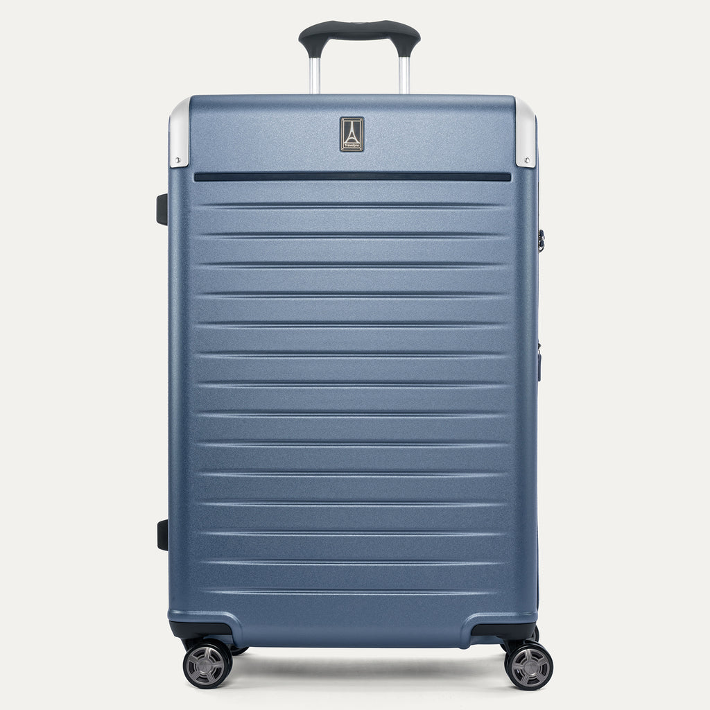 Front view of the Travelpro Platinum Elite Large Check-In Hardside Spinner in Dark Sky Blue, featuring a high-impact polycarbonate shell, aluminum corner armor, and genuine leather trim.
