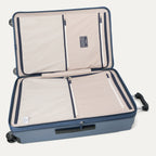 Interior view of the Travelpro Platinum Elite Large Check-In Hardside Spinner in Dark Sky Blue, featuring dual zippered divider panels and the ECOFAB™ lining made from recycled plastic bottles.